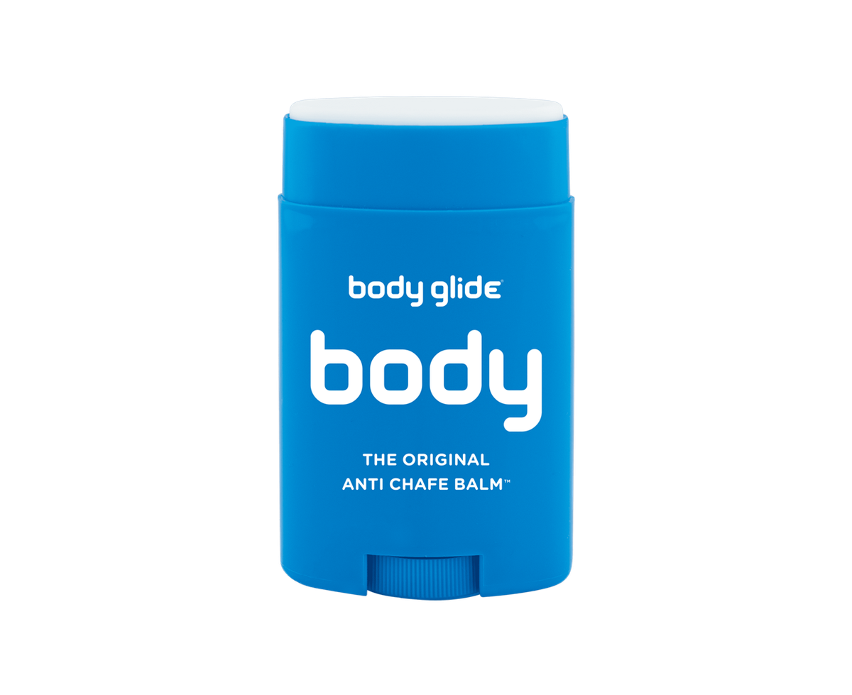 A blue cylindrical stick of Body Glide body anti-chafe balm, labeled "Body Glide Body," with a white cap. The package reads "The Original Anti Chafe Balm" in white text. The balm is intended to prevent skin chafing.