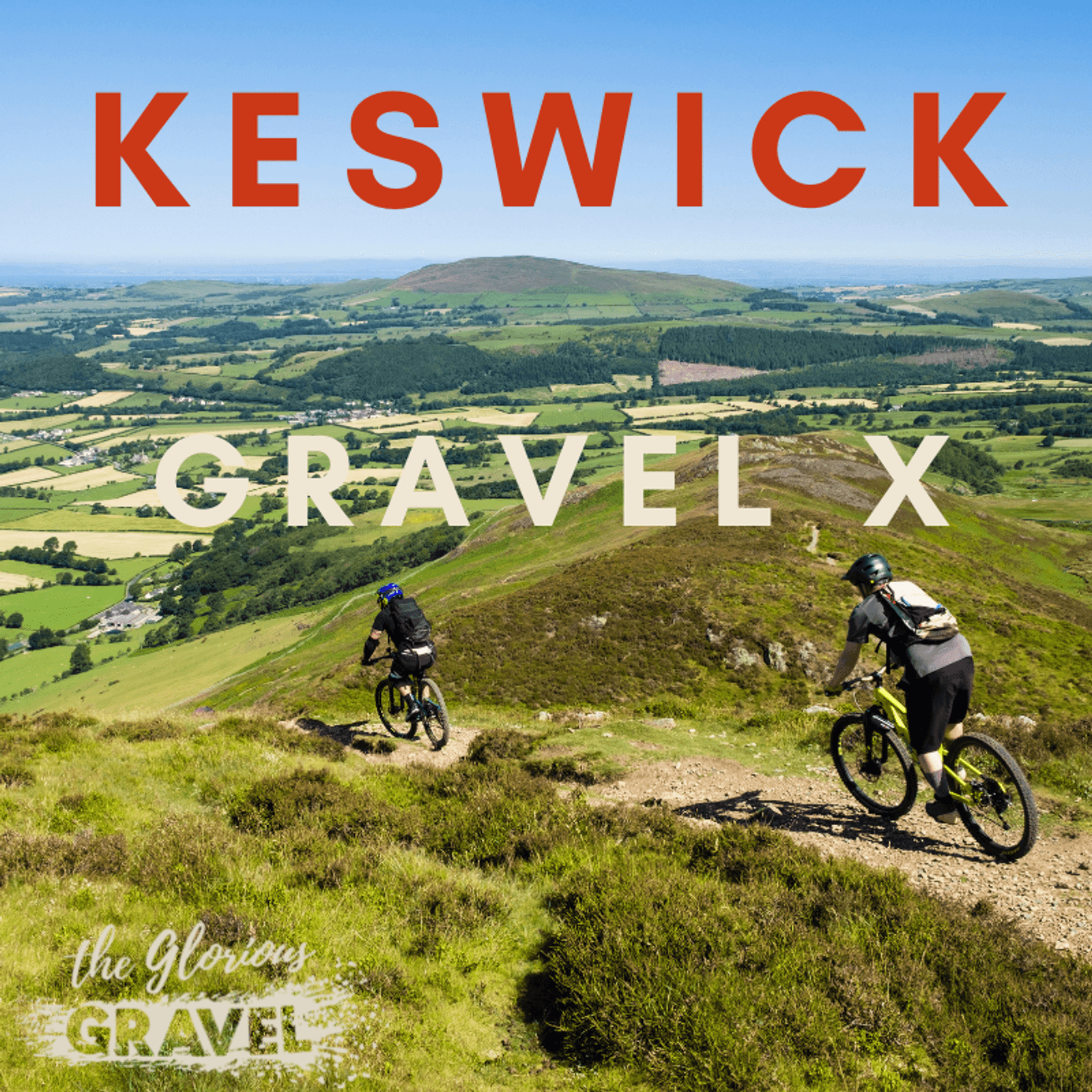Two cyclists ride on a gravel path down a lush green hill under a clear blue sky. The text "Keswick Gravel X" is prominently displayed at the top, and "the Glorious Gravel" is at the bottom. The scene overlooks a scenic countryside with fields, trees, and distant hills.