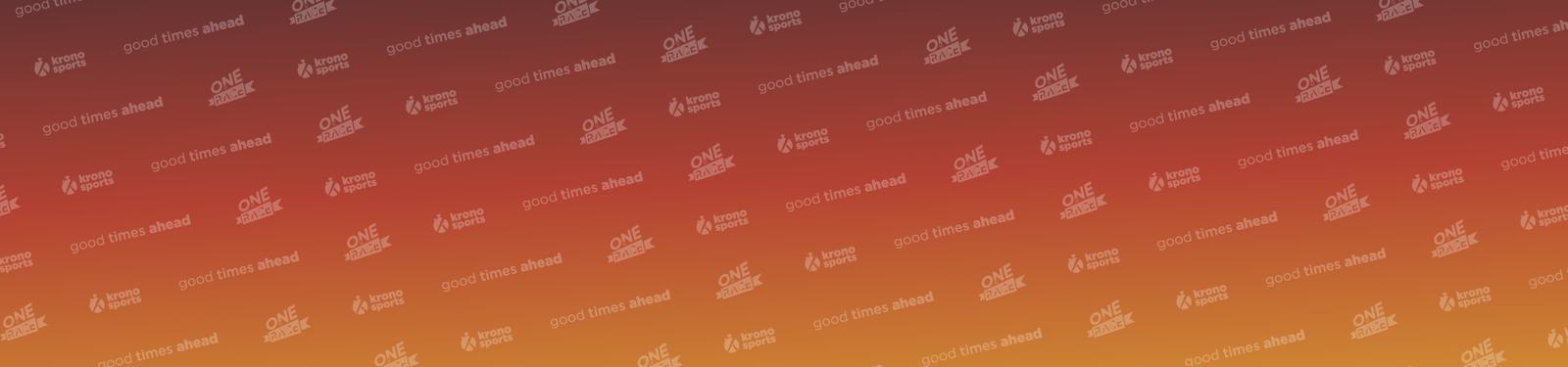 A gradient background shifts from red to orange and yellow, covered with subtly repeated motifs. These include "One Happy Island" and logos for Aruba, accompanied by the phrase "good times ahead.