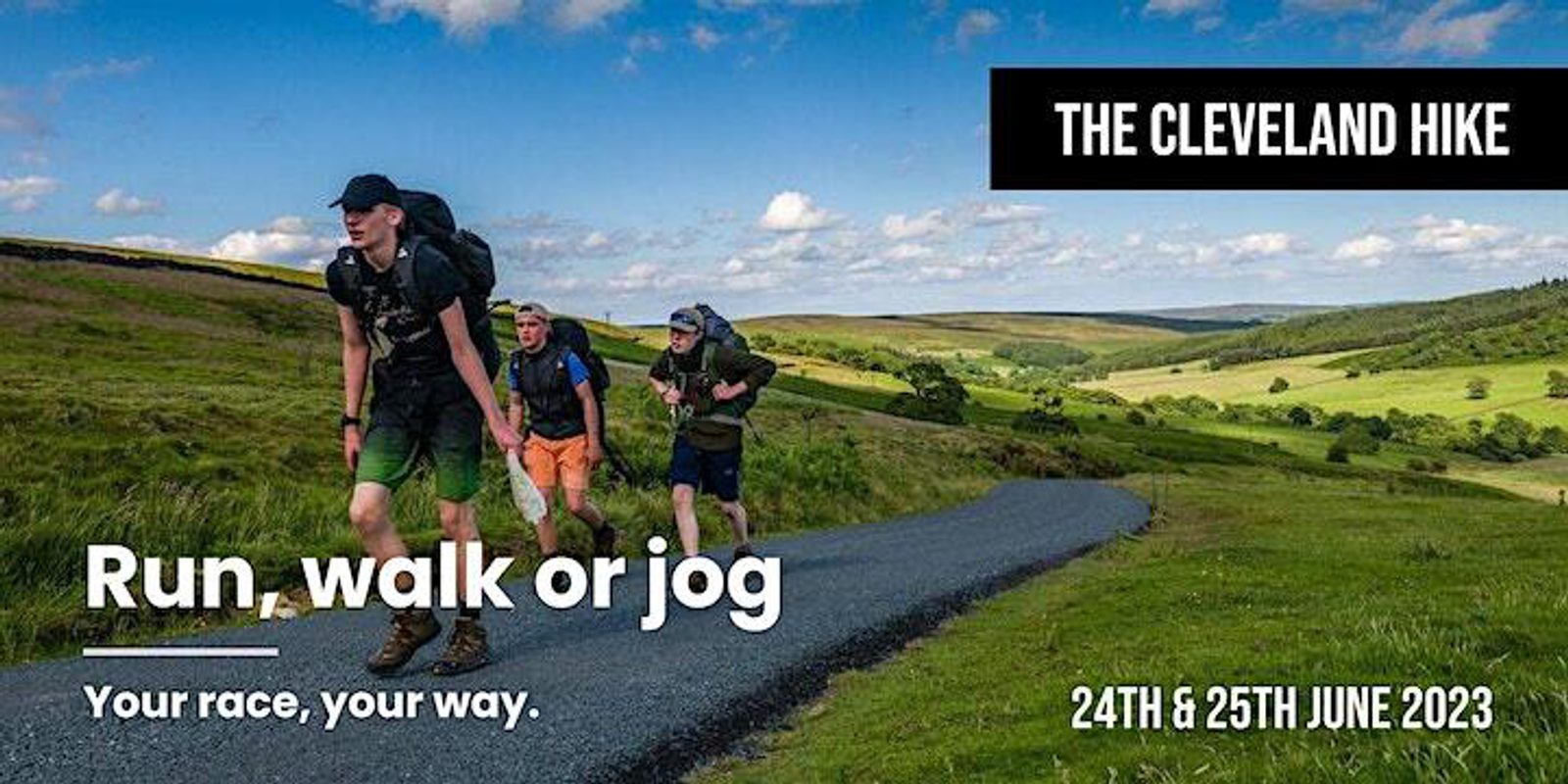 A group of hikers walks up a paved trail through a lush, green landscape under a blue sky with clouds. A banner reads "The Cleveland Hike" with "Run, walk or jog - Your race, your way." Event dates "24th & 25th June 2023" are shown at the bottom right.