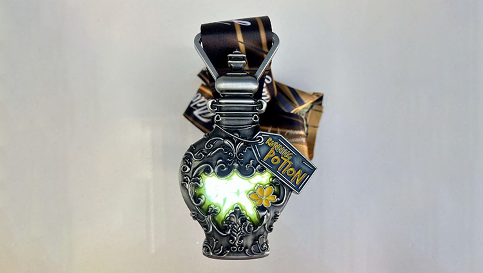 An intricately designed metallic potion bottle with glowing green content. It features gothic patterns and a tag reading "HP Half Blood Prince Potion." A ribbon is tied to the bottle's neck.