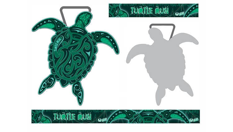 A green turtle-shaped finisher medal with tribal patterns, labeled "Turtle Run." The medal is displayed frontally, with a shadowed back view and a matching green ribbon featuring "Turtle Run" text.