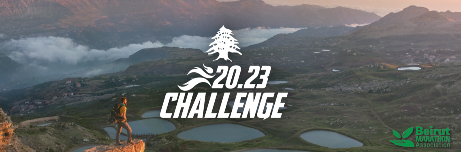A hiker stands on a rocky ledge overlooking a breathtaking mountainous landscape with several serene lakes. Overlaid text reads "20.23 Challenge" with a tree and wave motif. The Beirut Marathon Association logo appears in the bottom right corner.