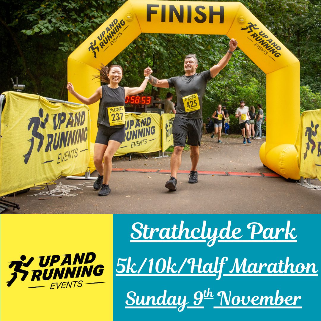 Two smiling runners holding hands cross a yellow inflatable finish line arch at a race in Strathclyde Park, with “Up and Running Events” banners and text promoting a 5k/10k/half marathon on Sunday, 9th November.