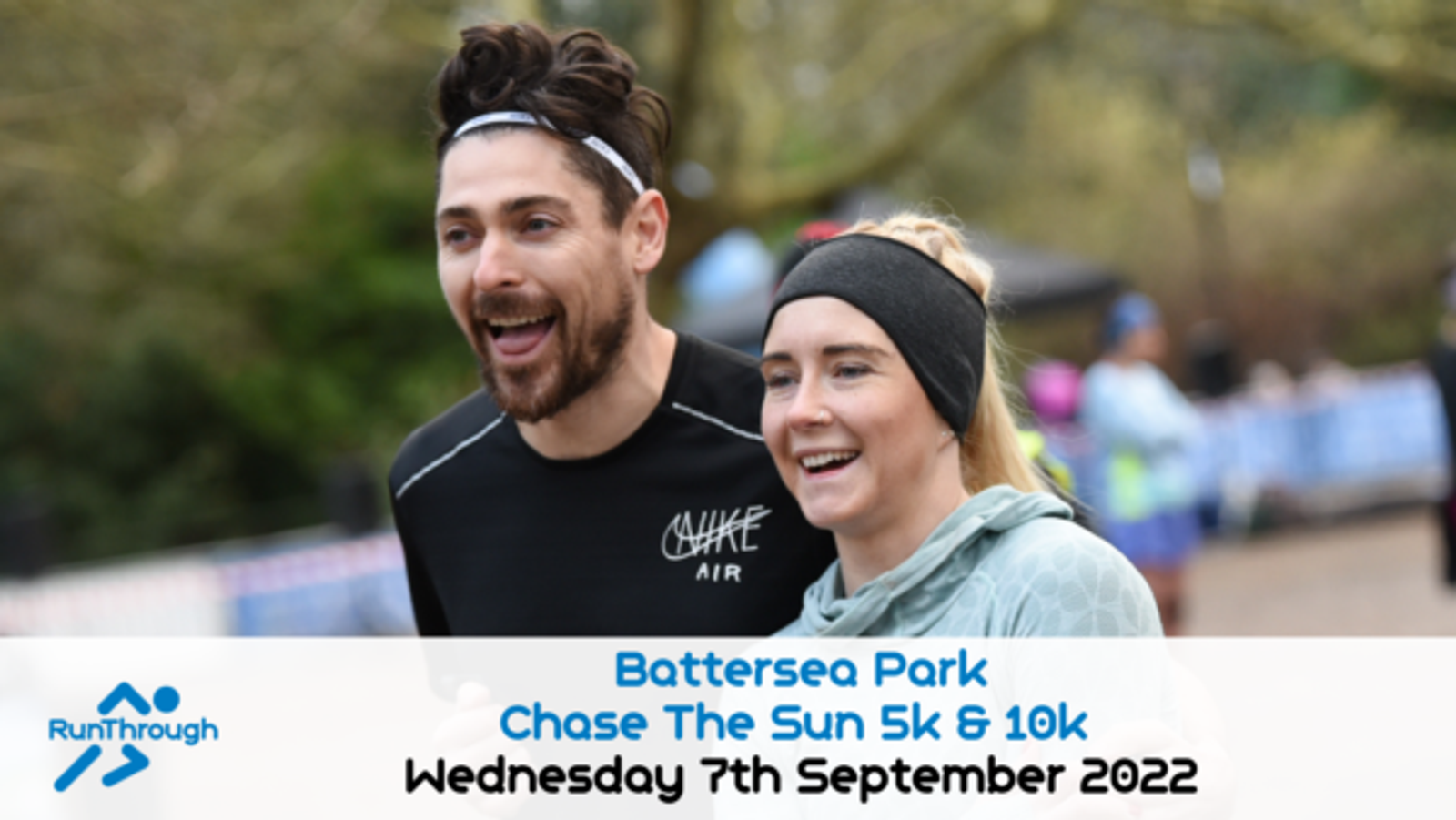Two people are running and smiling at an event in Battersea Park. Both are wearing athletic clothing, and there is a banner at the bottom with event information: "Battersea Park Chase The Sun 5k & 10k, Wednesday 7th September 2022," along with the RunThrough logo.