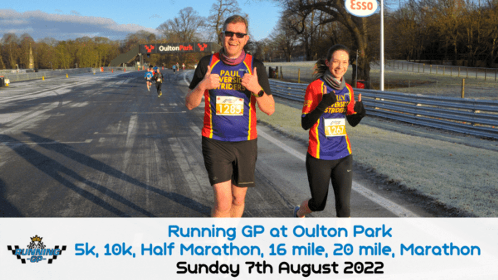 Two smiling runners waving at the camera during an event at Oulton Park. The man is wearing sunglasses and a black and red outfit, while the woman is wearing a similar outfit. The text reads: "Running GP at Oulton Park" and provides race details and date: "Sunday 7th August 2022.