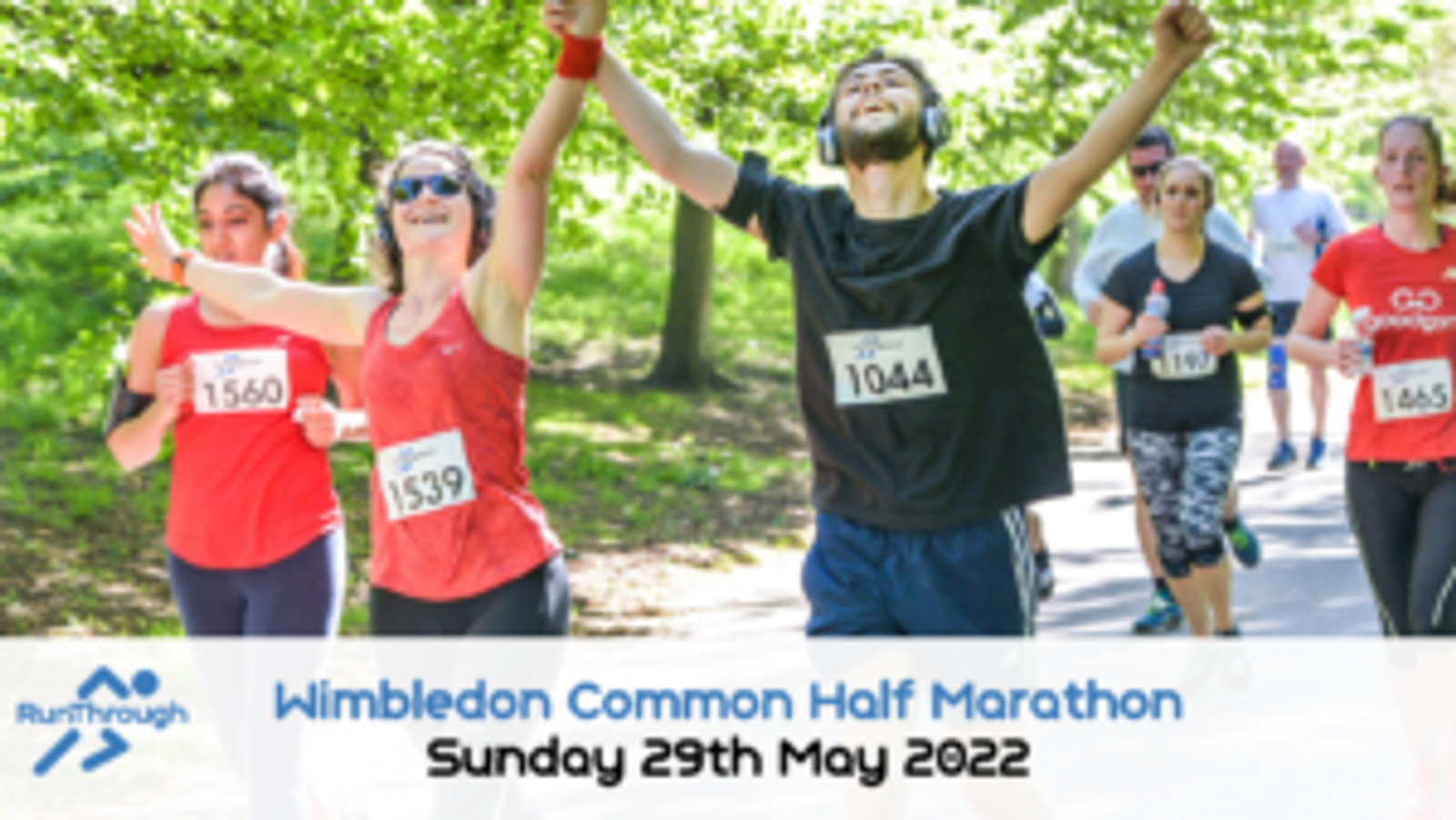Runners in the Wimbledon Common Half Marathon are shown smiling and cheering as they run through a shaded, tree-lined path. They are wearing race bibs and athletic gear. The text on the image reads "Wimbledon Common Half Marathon, Sunday 29th May 2022.