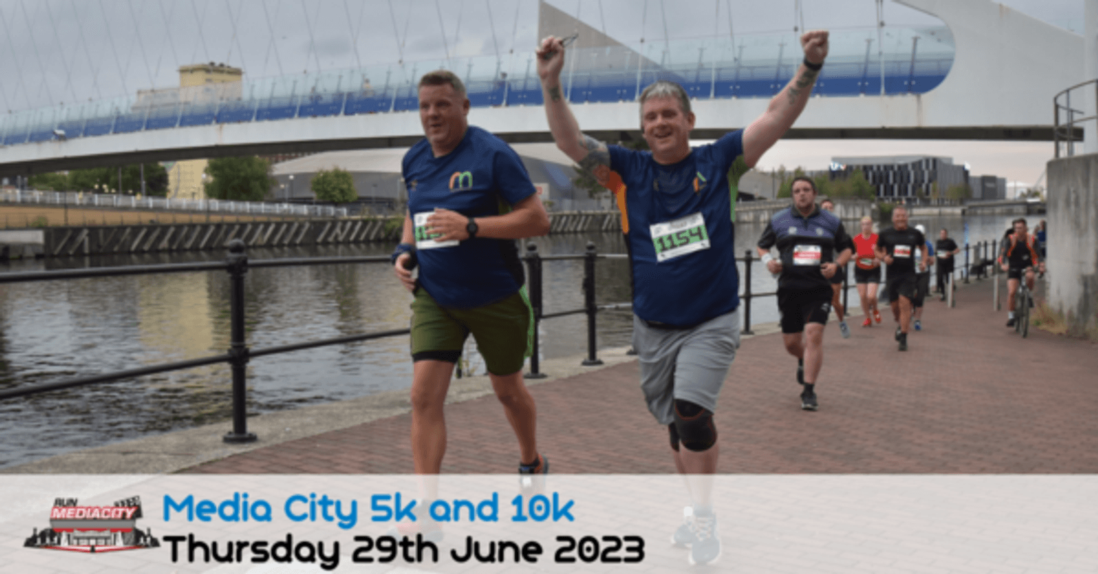 Several runners are participating in a race along a waterfront with a modern bridge in the background. One runner in the foreground raises his arms in celebration. A banner at the bottom reads, "Media City 5k and 10k, Thursday 29th June 2023.