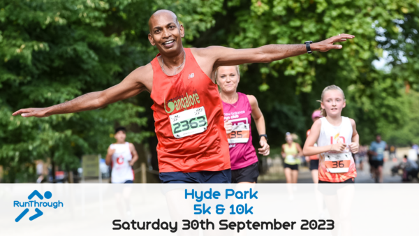 A joyful man in an orange shirt, arms outstretched, leads a group of runners at a park event. Behind him, other participants include a woman in a pink shirt and a child in a white tank top. A banner at the bottom reads "Hyde Park 5k & 10k, Saturday 30th September 2023".