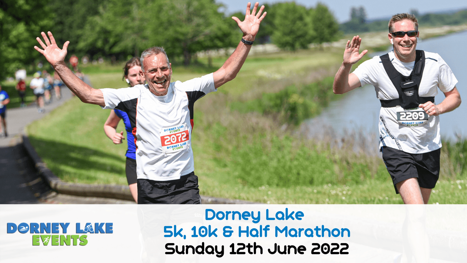 Runners smile and wave at the camera as they participate in the Dorney Lake 5k, 10k & Half Marathon event on a sunny day. Text at the bottom reads "Dorney Lake 5k, 10k & Half Marathon Sunday 12th June 2022".
