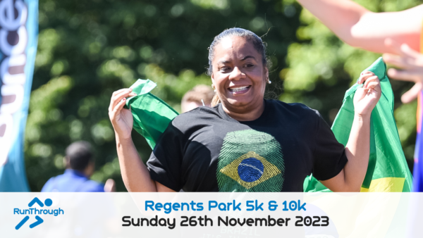 A woman is smiling and holding a Brazilian flag behind her back while running, wearing a t-shirt with a Brazilian flag design. The banner at the bottom displays "Regents Park 5k & 10k" and "Sunday 26th November 2023" with the RunThrough logo on the left.
