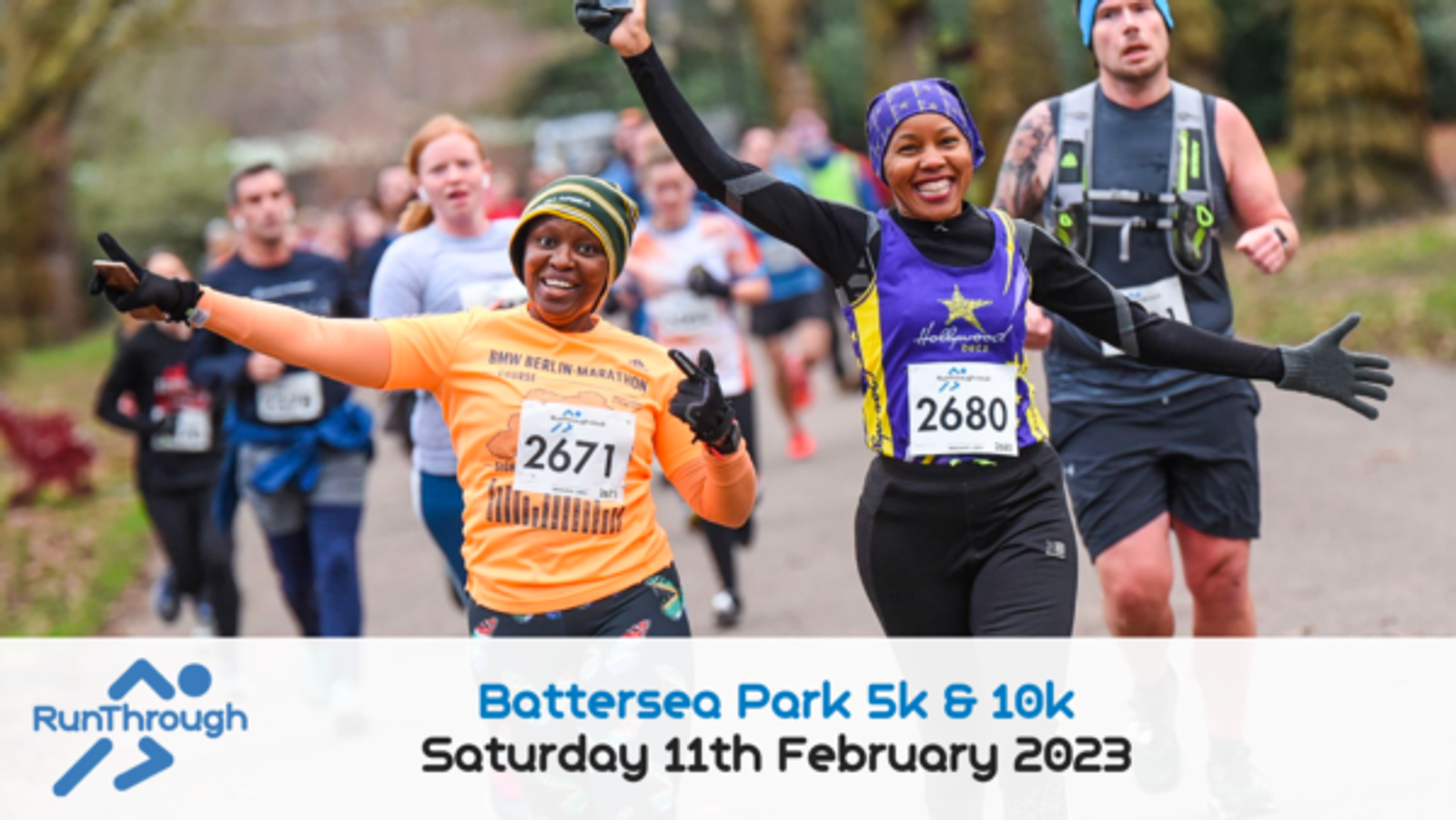 Two smiling runners are captured mid-stride in a marathon at Battersea Park on Saturday, 11th February 2023. Both wear bright athletic gear and race numbers (2671 and 2680). Behind them, several other participants are also visible. RunThrough logo is included.
