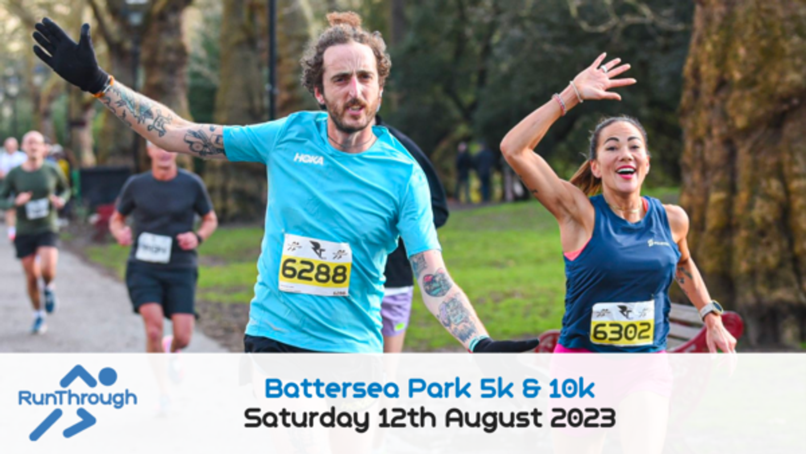 A man and woman cheerfully run in a park during a race, both wearing running bibs. The man has his arms outstretched, and the woman waves. Other runners are visible in the background. The text reads: "Battersea Park 5k & 10k, Saturday 12th August 2023," with a logo of "RunThrough.