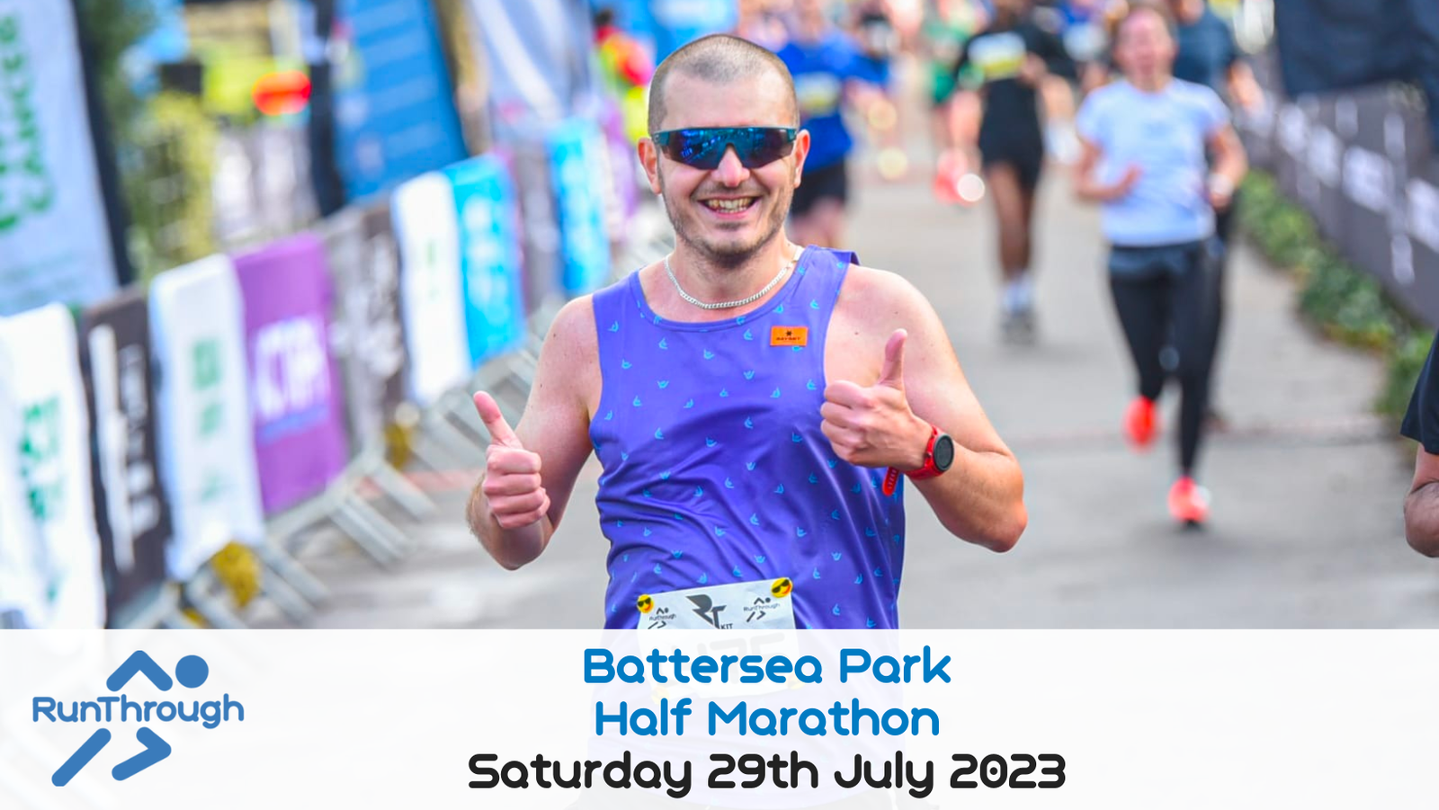 A smiling runner with a blue sleeveless top, sunglasses, and a race number runs through a track, giving two thumbs up. Banners and other participants are visible in the background. Text at the bottom reads "Battersea Park Half Marathon, Saturday 29th July 2023" and "RunThrough.