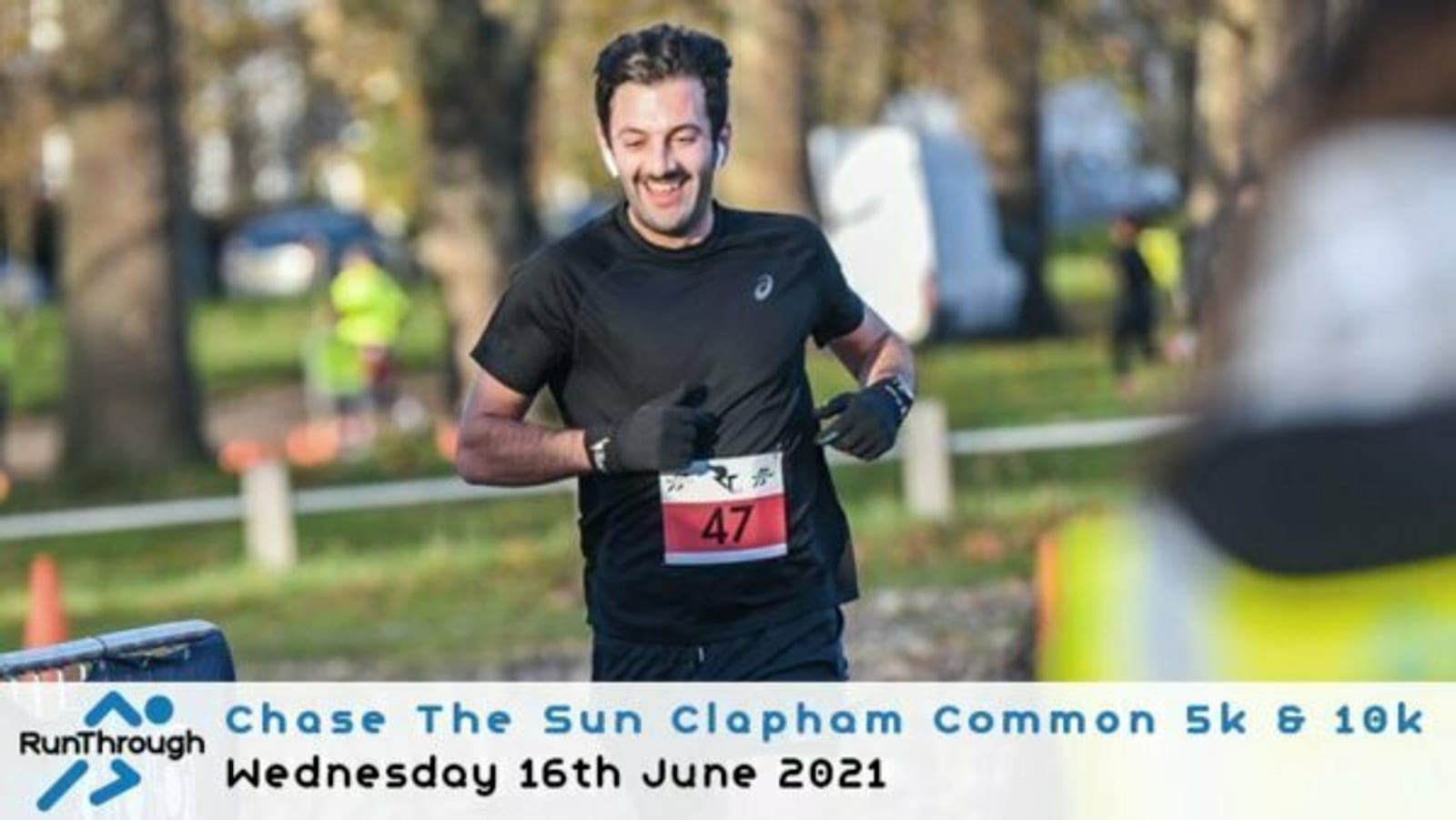 A man is running in a race at Clapham Common, wearing a bib with the number 47. He is smiling and appears to be running in a park area with trees in the background. Text at the bottom reads "Chase The Sun Clapham Common 5k & 10k, Wednesday 16th June 2021.