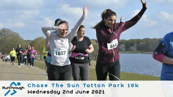 A group of runners, predominantly women, participate in the "Chase The Sun Tatton Park 10k" on a sunny day, with a lake and trees in the background. Two women in the foreground wear race numbers 1807 and 464, smiling and raising their arms as they run. The event logo and date "Wednesday 2nd June 2021" are displayed at the bottom.