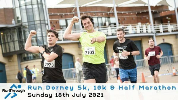 A group of runners near the finish line of a race, celebrating their achievement. The runner in the center, wearing a lime green shirt and bib number 2102, raises his arms triumphantly. Event details are displayed at the bottom: "Run Dorney 5k, 10k & Half Marathon, Sunday 18th July 2021.