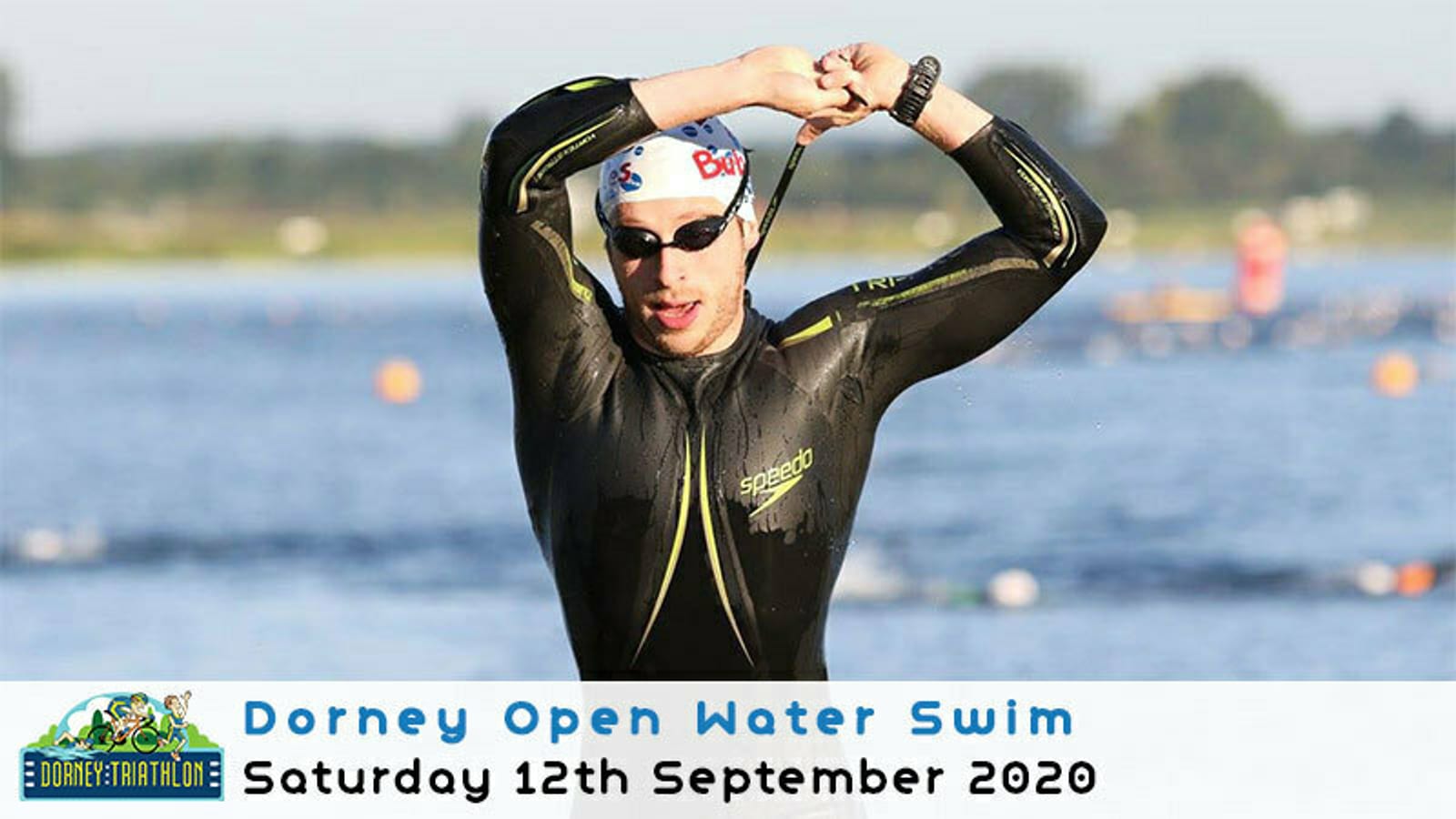 A swimmer in a black wetsuit and swim cap emerges from the water, adjusting his goggles. The image is captioned "Dorney Open Water Swim, Saturday 12th September 2020" with a small event logo in the corner. The background shows a lake with distant swimmers.