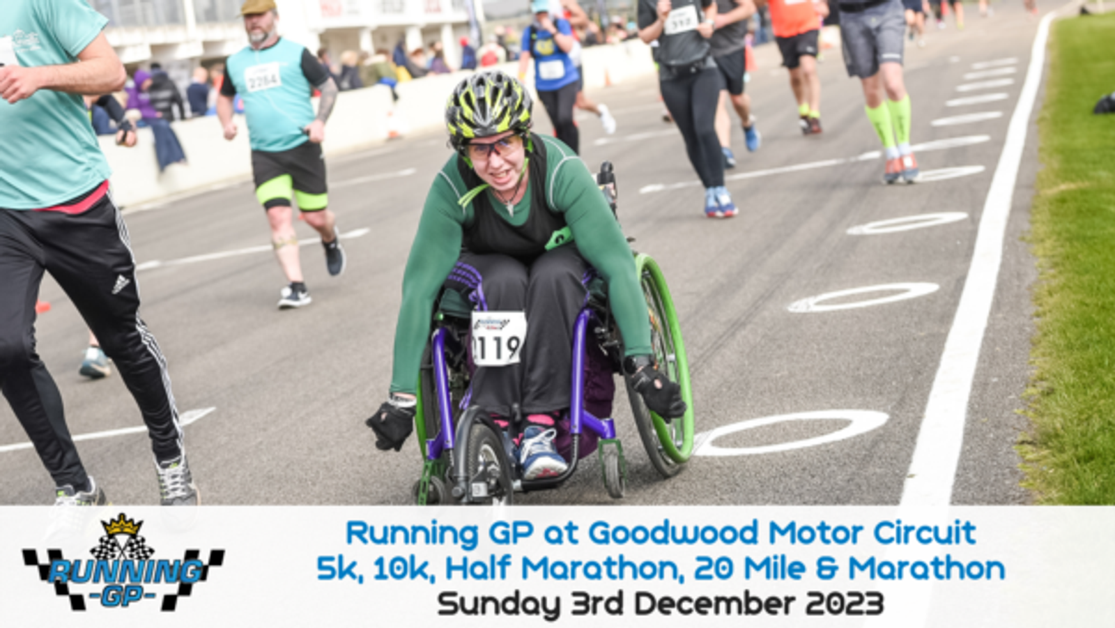 Participant in a wheelchair races at the Running GP on Goodwood Motor Circuit. Additional runners are visible in the background. Event details are displayed at the bottom of the image: "Running GP at Goodwood Motor Circuit, 5k, 10k, Half Marathon, 20 Mile & Marathon, Sunday 3rd December 2023.