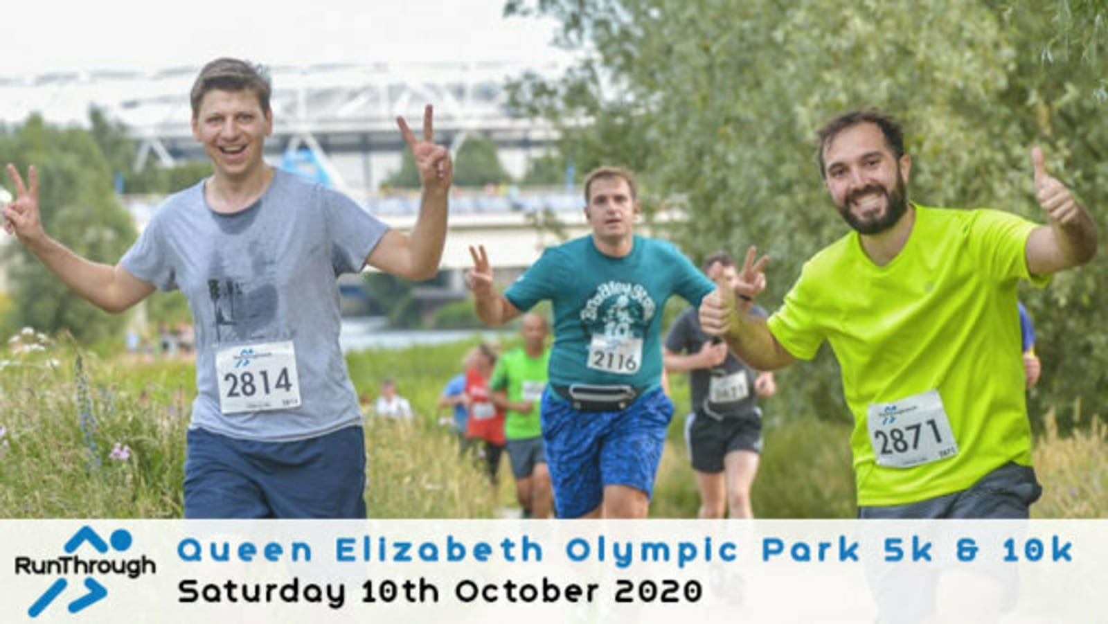 Three runners, wearing race bibs 2814, 2116, and 2871, flash peace signs as they participate in the Queen Elizabeth Olympic Park 5k & 10k on Saturday, 10th October 2020. The event is hosted by RunThrough, with greenery and a bridge in the background.