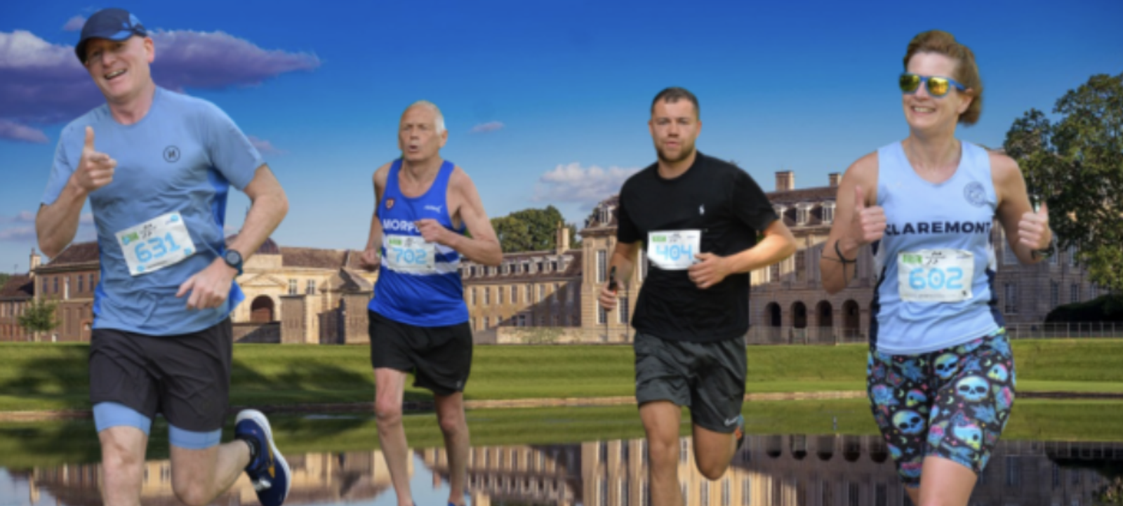 Four runners are participating in a race outdoors. Two men and one woman wear blue bibs, and one man wears a black bib. They run alongside a large historic building under a blue sky with scattered clouds. The participants appear focused and determined.