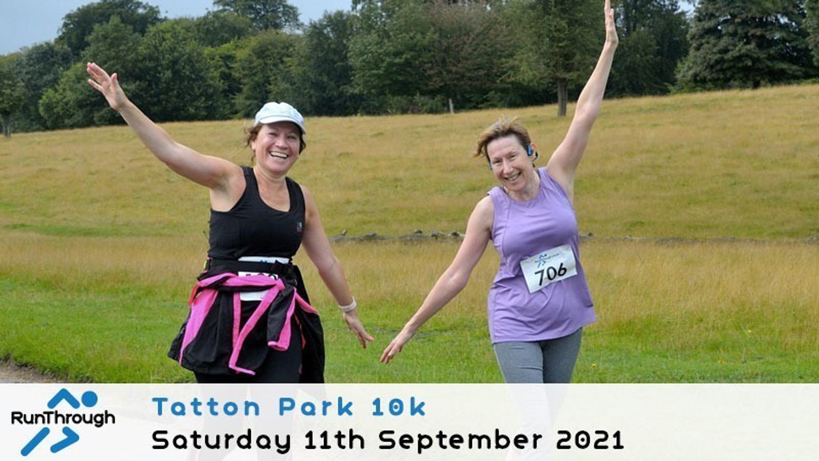 Two smiling women with race bibs run outdoors on a grassy path, raising their arms in celebration. A banner reads: "Tatton Park 10k, Saturday 11th September 2021" with the RunThrough logo in the corner.