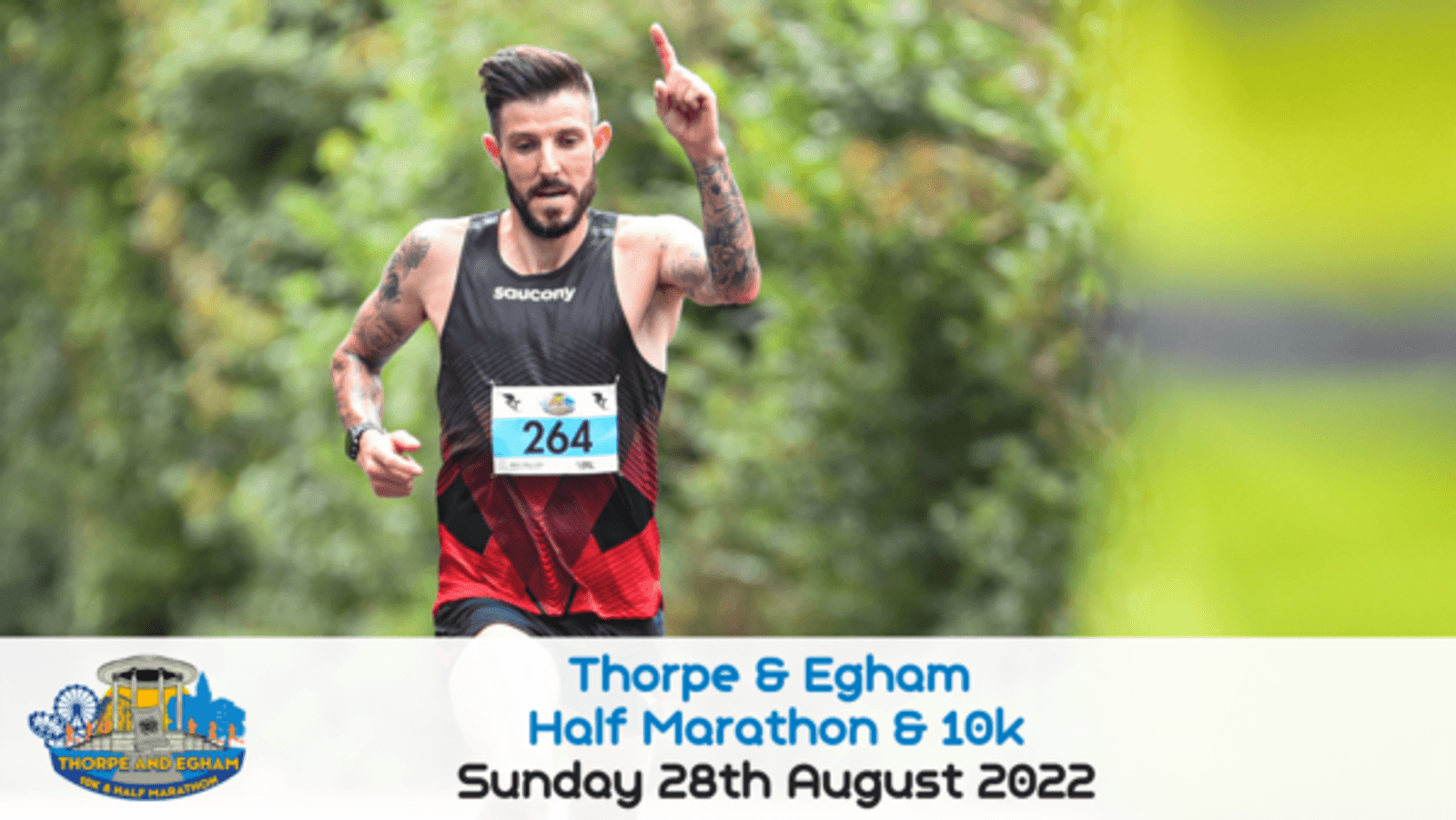 A runner wearing a black and red Saucony outfit and bib number 264 is captured mid-stride during the Thorpe & Egham Half Marathon & 10k. The event details and date "Sunday 28th August 2022" are displayed at the bottom against a blurred green background.