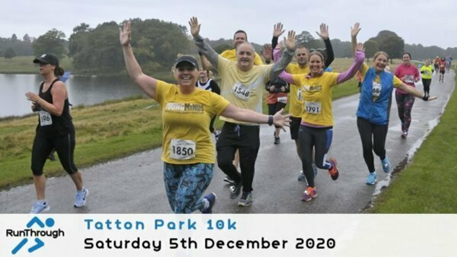 A group of smiling runners in colorful shirts wave and gesture as they run along a park path during the Tatton Park 10k event on a cloudy day. Event details and date appear at the bottom of the image.
