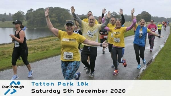 A group of smiling runners in colorful shirts wave and gesture as they run along a park path during the Tatton Park 10k event on a cloudy day. Event details and date appear at the bottom of the image.