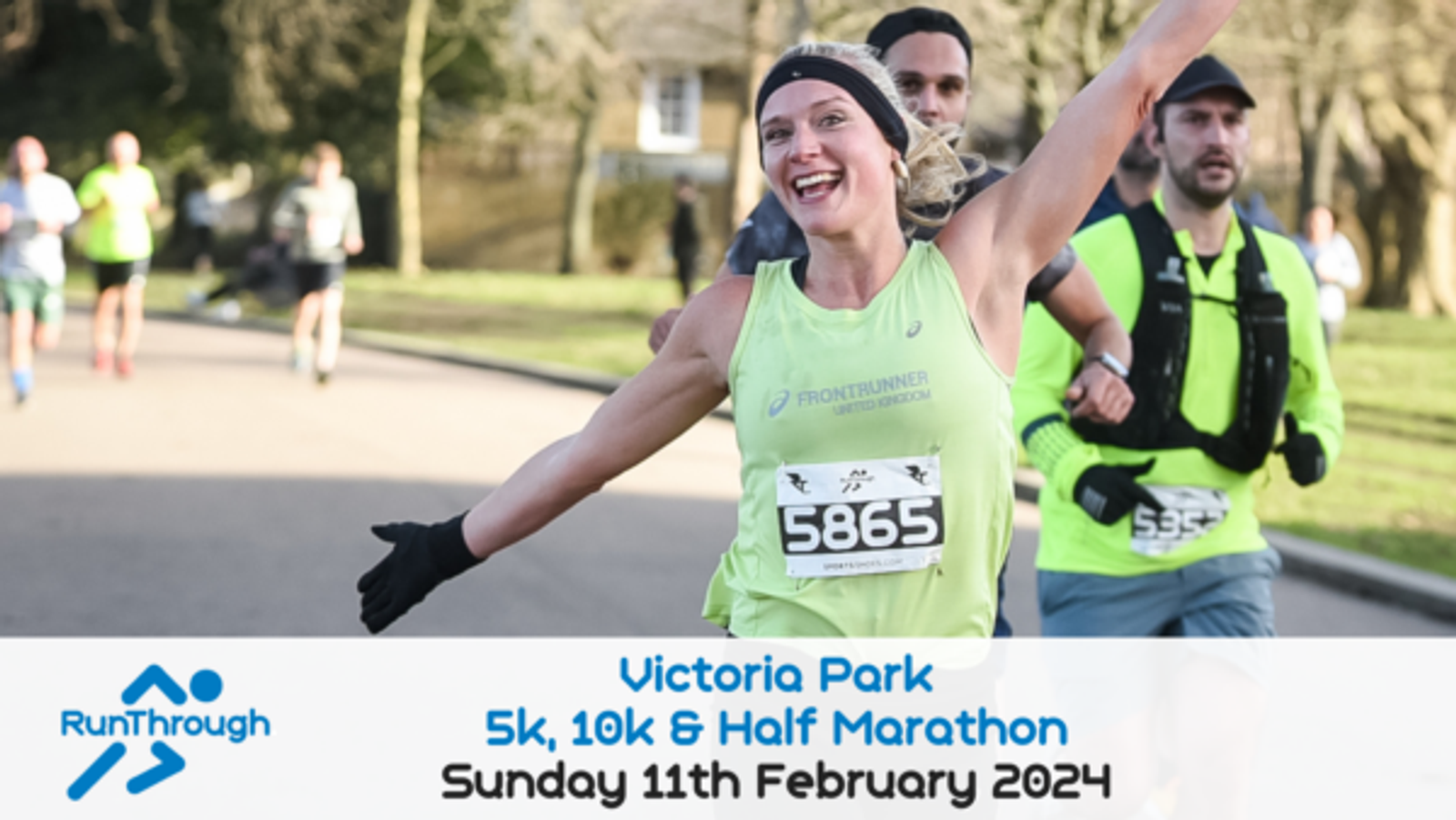 A group of runners, wearing race bibs and running gear, are participating in an outdoor race in Victoria Park. One smiling woman in a green tank top with bib number 5865 is running with her arms outstretched. Below, event details read, "Victoria Park 5k, 10k & Half Marathon, Sunday 11th February 2024.
