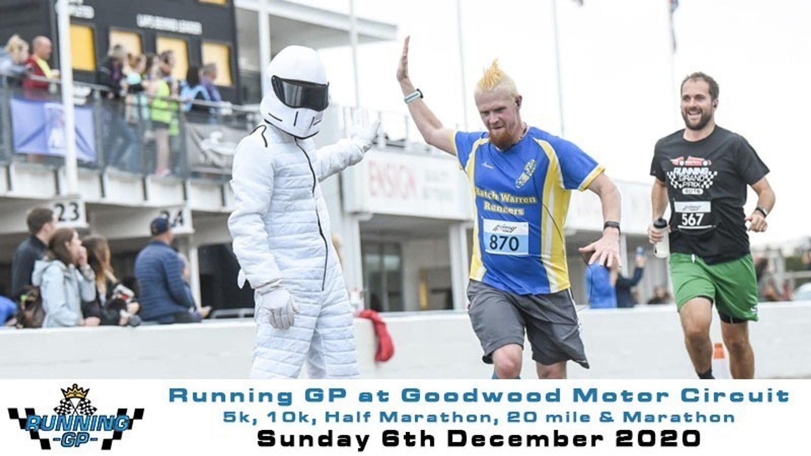 A man in a white racing suit and helmet high-fives a blonde runner in a blue and yellow jersey with number 870. Another runner in a black outfit with number 367 is also visible, smiling. The event banner at the bottom reads "Running GP at Goodwood Motor Circuit" dated December 6th, 2020.