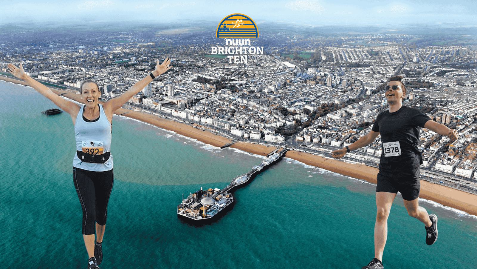 Two runners, a woman and a man, joyfully pose mid-air with arms outstretched above a backdrop of Brighton's beach and pier. They wear numbered running bibs, and the horizon stretches into the distance. The scene promotes the "Nuun Brighton Ten" event.