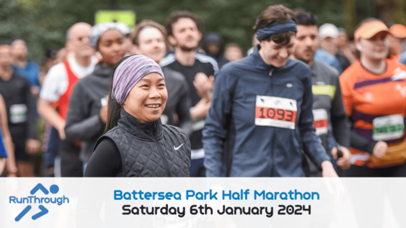 Participants, wearing athletic gear, smile and run in the Battersea Park Half Marathon. A banner at the bottom shows the event date as Saturday, 6th January 2024, and the RunThrough event logo is on the left.