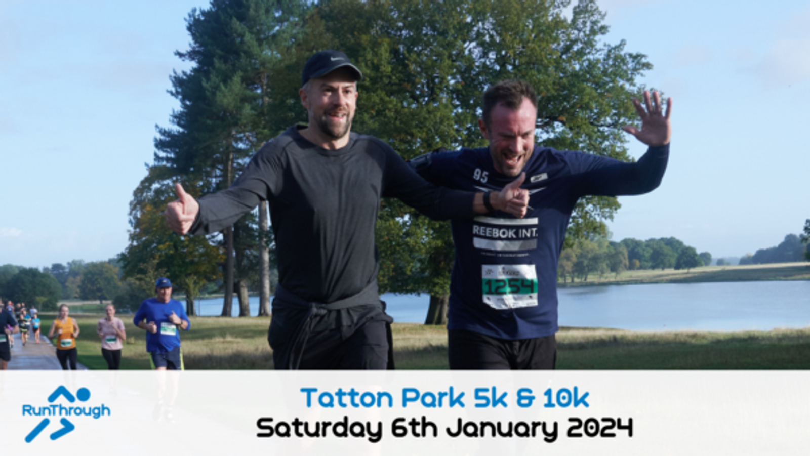 Two runners, one in a gray long-sleeve shirt and hat, and the other in a blue long-sleeve Reebok shirt, are smiling and raising their arms in excitement as they approach the finish line at Tatton Park. Other runners are seen in the background. Event details are at the bottom.