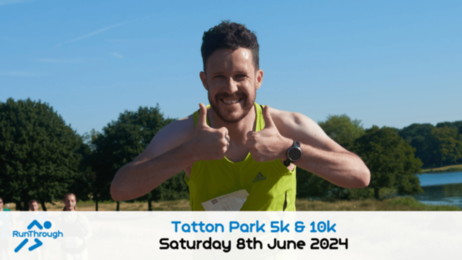 A man is running in a race, giving two thumbs up and smiling. He is wearing a green tank top and a race bib. The event is the Tatton Park 5k & 10k held on Saturday 8th June 2024. The background shows clear blue skies and greenery.