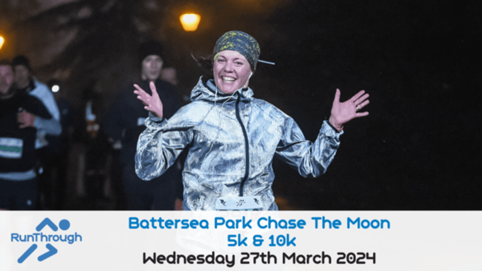 A woman in a reflective jacket smiles with her arms raised in celebration while running at night. Visible behind her are other runners. Text overlay reads: "RunThrough Battersea Park Chase The Moon 5k & 10k. Wednesday 27th March 2024.
