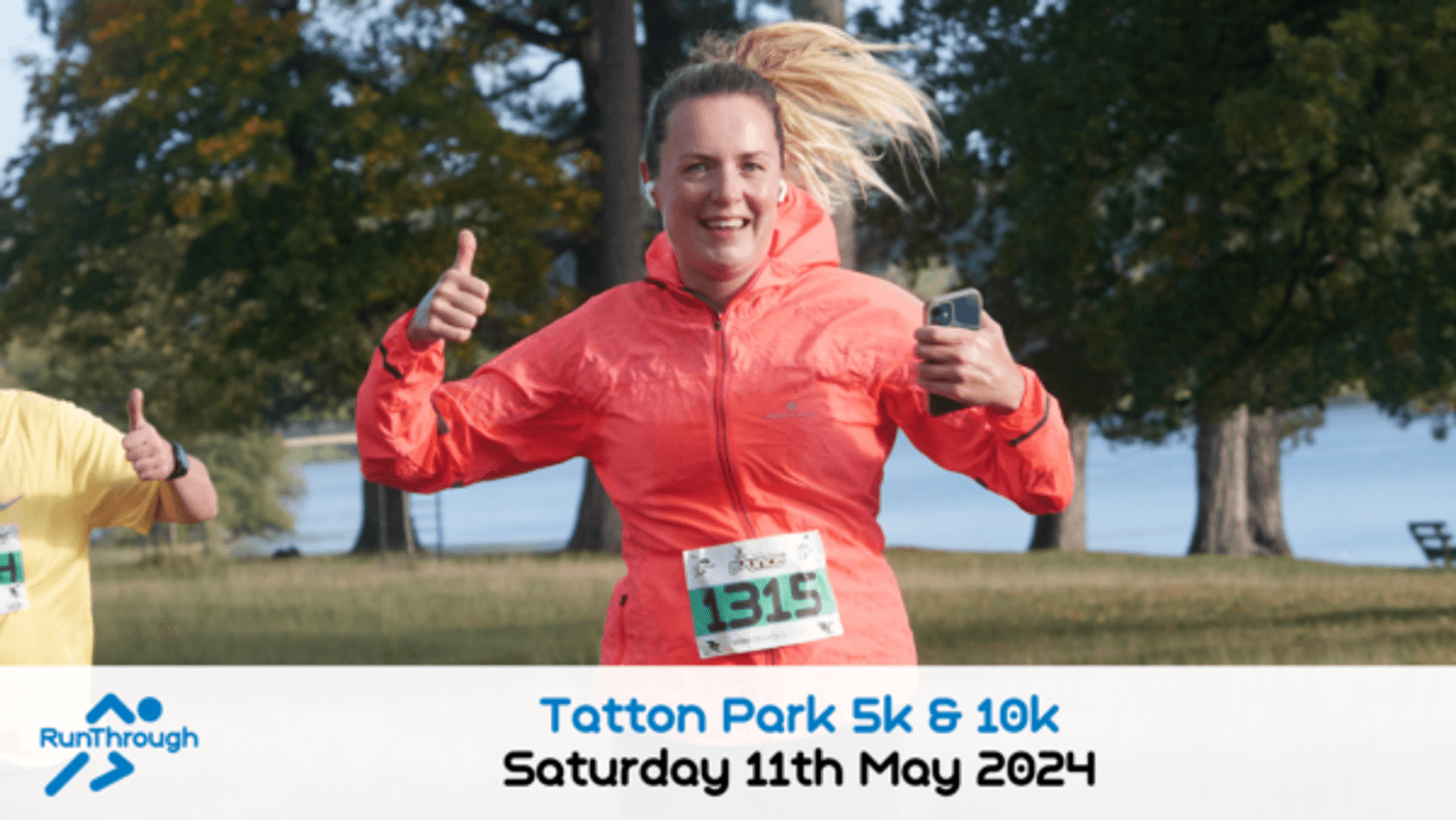 A woman wearing a bright orange jacket, smiling and giving thumbs-up gestures, is running outdoors. She has a race bib number "1315" pinned to her jacket. Text below reads: "Tatton Park 5k & 10k, Saturday 11th May 2024," with the RunThrough logo on the left.