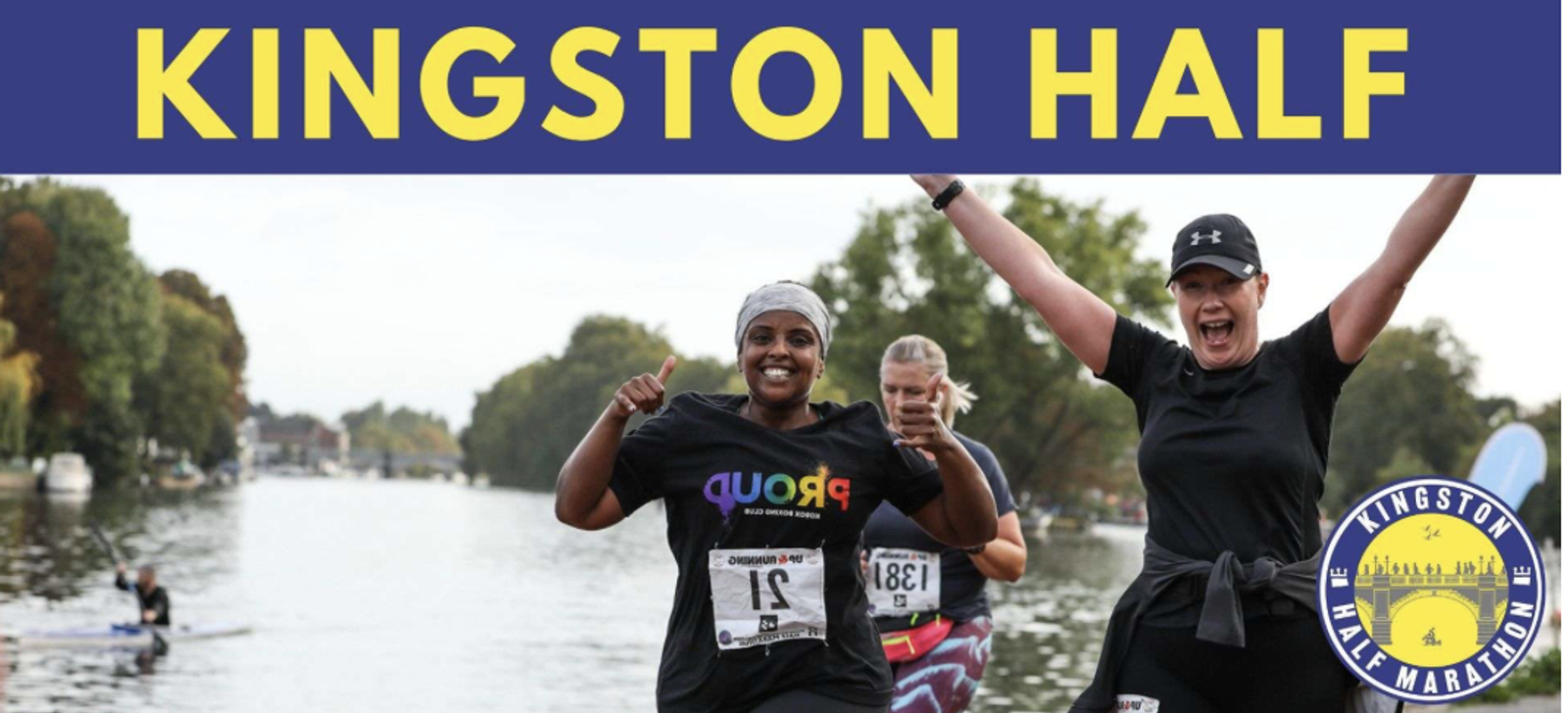 Two runners smile and gesture energetically towards the camera during the Kingston Half Marathon. They are running on a path beside a body of water, with trees in the background. The event's logo and the text "Kingston Half" are prominently displayed at the top.