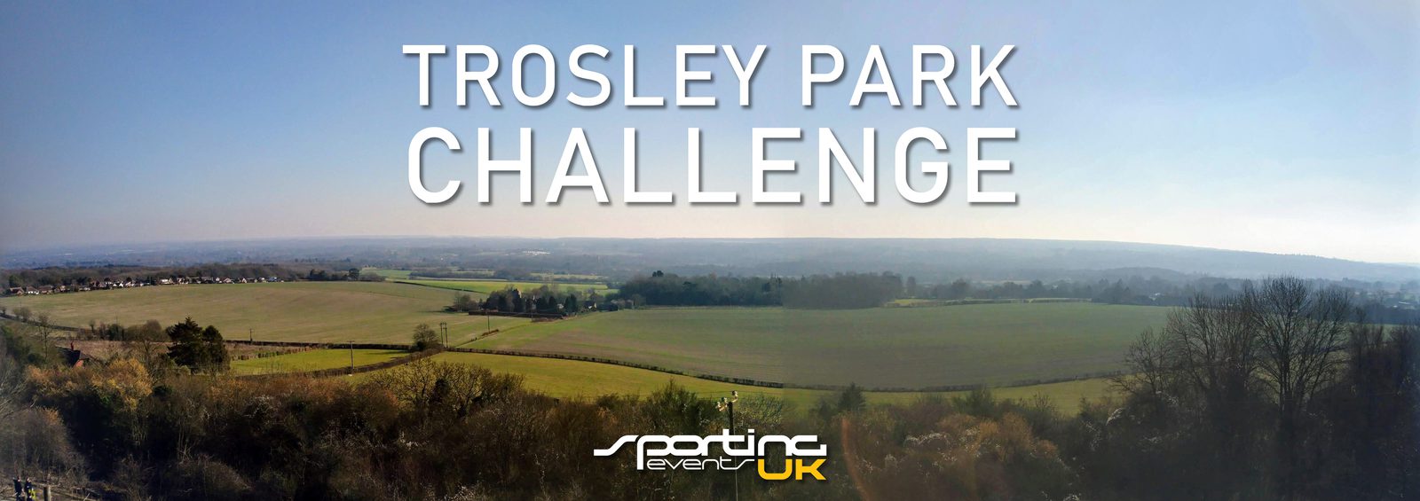 A panoramic view of Trosley Park with vast green fields and distant wooded areas under a clear blue sky. Text overlaid on the image reads "Trosley Park Challenge" and "Epic Events UK" at the bottom.