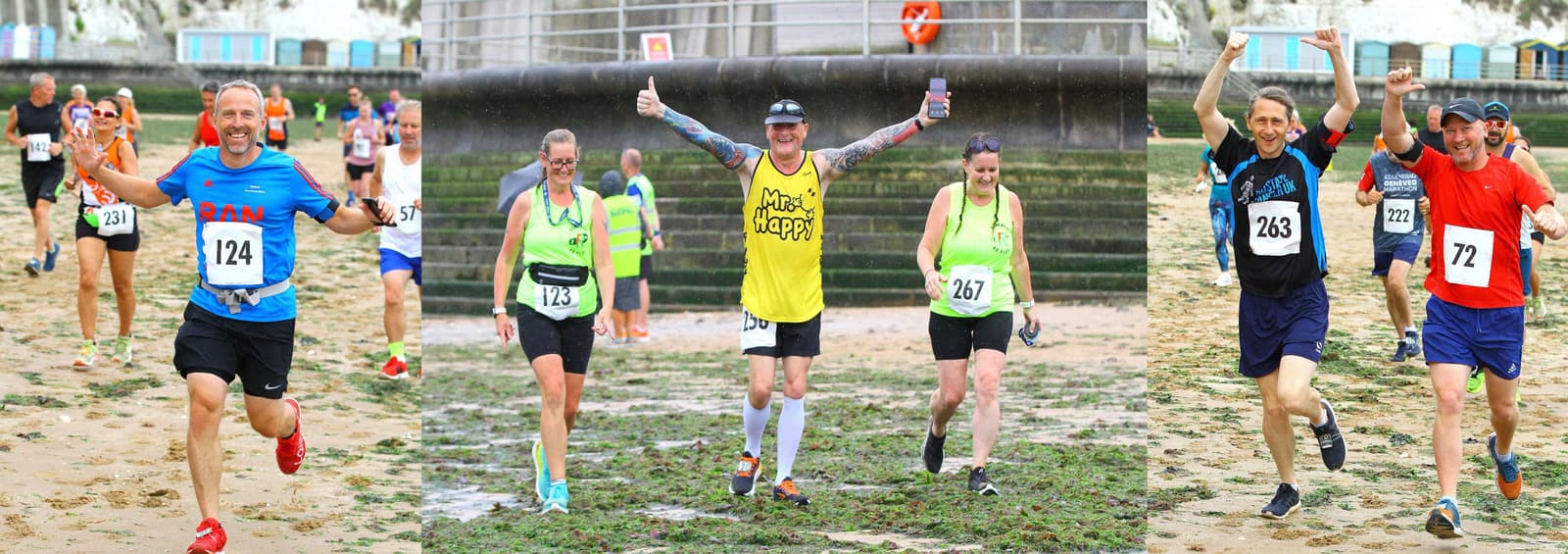 Runners in numbered shirts smile and wave energetically on a sandy, grassy beach during a race. A man in a yellow "Miles of Smiles" vest gives a thumbs-up, while others display victory gestures. A concrete structure and spectators are in the background.
