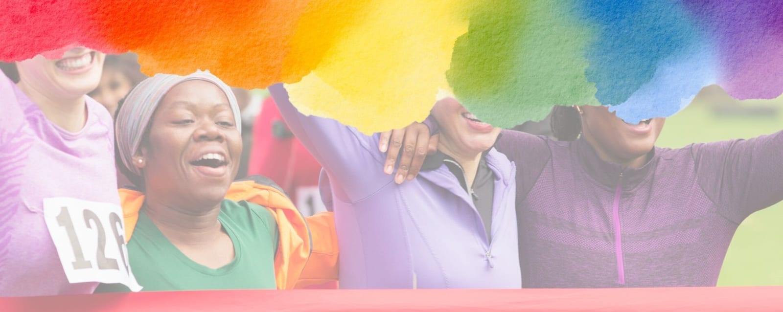Four women in athletic wear celebrate together at a finish line, partially covered by a vibrant, watercolor rainbow splash across the top of the image.