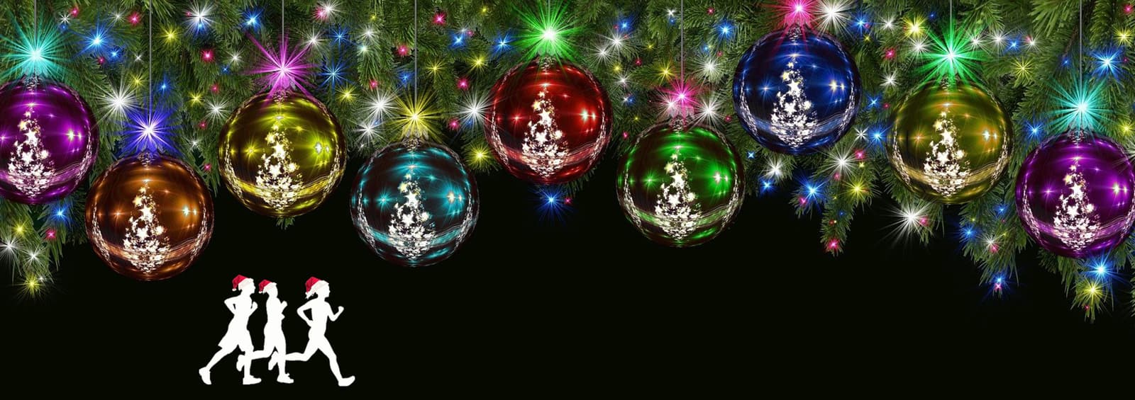 Festive holiday scene with colorful ornaments hanging against a black background. Green pine branches are adorned with twinkling lights. Silhouettes of three people in Santa hats are walking or running in the bottom left corner.