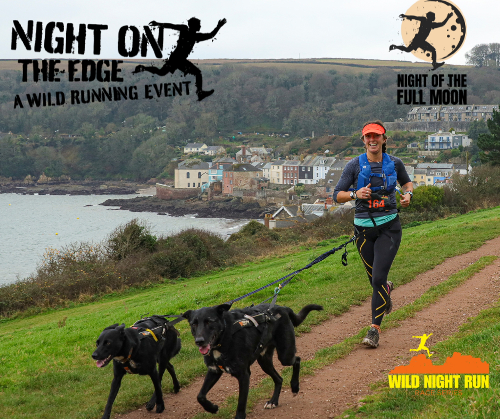 A runner, smiling and wearing a blue and orange outfit with a race bib, runs along a coastal trail with two black dogs on leashes. The background shows a picturesque seaside village. Event logos for "Night on the Edge" and "Wild Night Run" are visible.