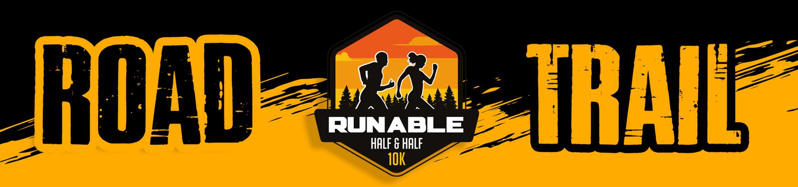 A banner with a black and yellow color scheme. It features the words "ROAD" on the left, "TRAIL" on the right, and a central emblem displaying two runners, a sunset, trees, and the text "RUNABLE HALF & HALF 10K.