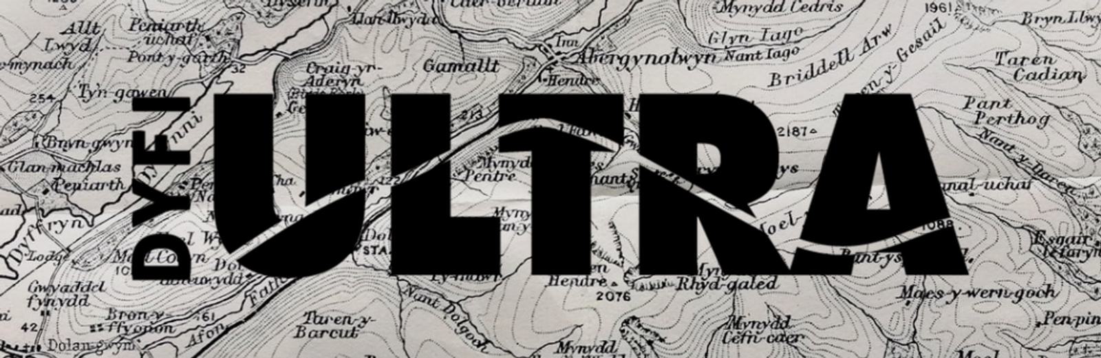 A grayscale topographical map with the bold text "DYFI ULTRA" overlaid in black. The letters are stylized with lines and angles intersecting, reminiscent of mountain peaks. The background map features various geographic details and place names.
