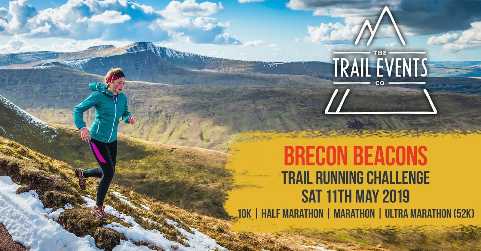 A woman runs along a snowy mountain trail under a blue, partly cloudy sky. Text reads: "Brecon Beacons. Trail Running Challenge. Sat 11th May 2019. 10K | Half Marathon | Marathon | Ultra Marathon (52K)." The Trail Events Co logo is visible in the top right corner.