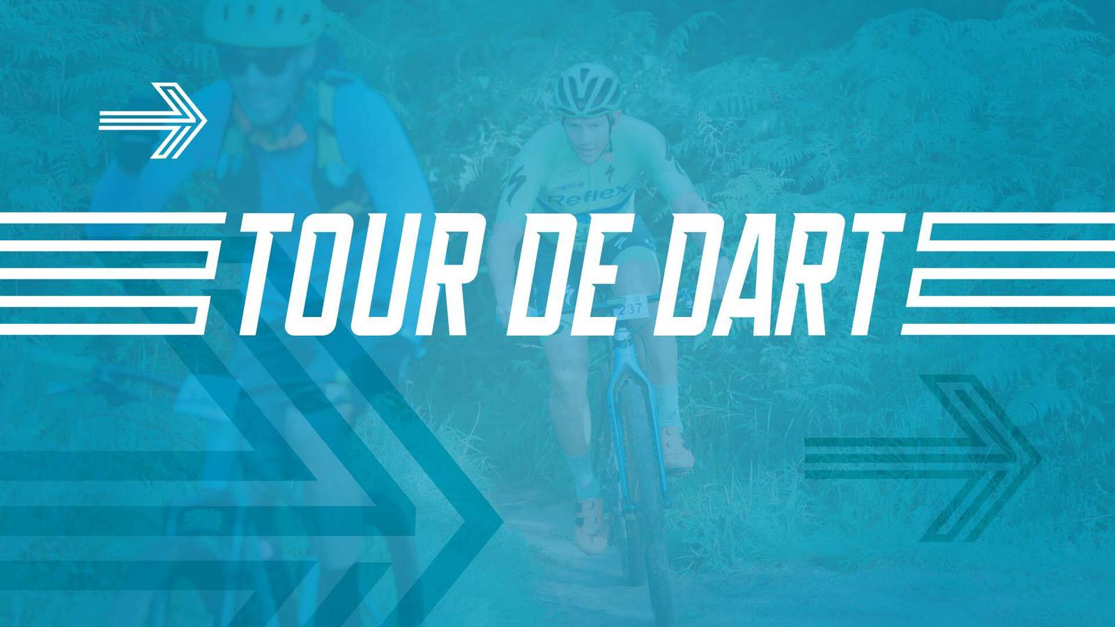 Two cyclists ride on a dirt path in the background with overlaid, large white text that reads "TOUR DE DART." The image is heavily tinted blue with arrows pointing left and right.