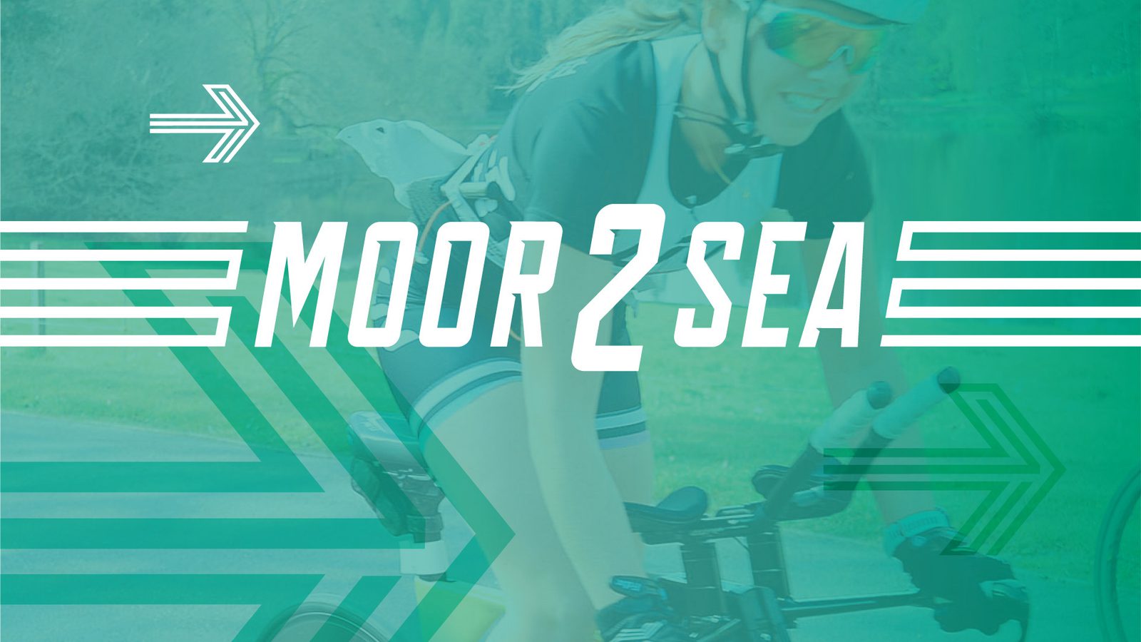 A cyclist wearing a helmet and sunglasses rides a bike, smiling, with greenery in the background. Overlaid text reads "MOOR 2 SEA" in white, flanked by stylized arrow graphics. The image has a translucent green filter.