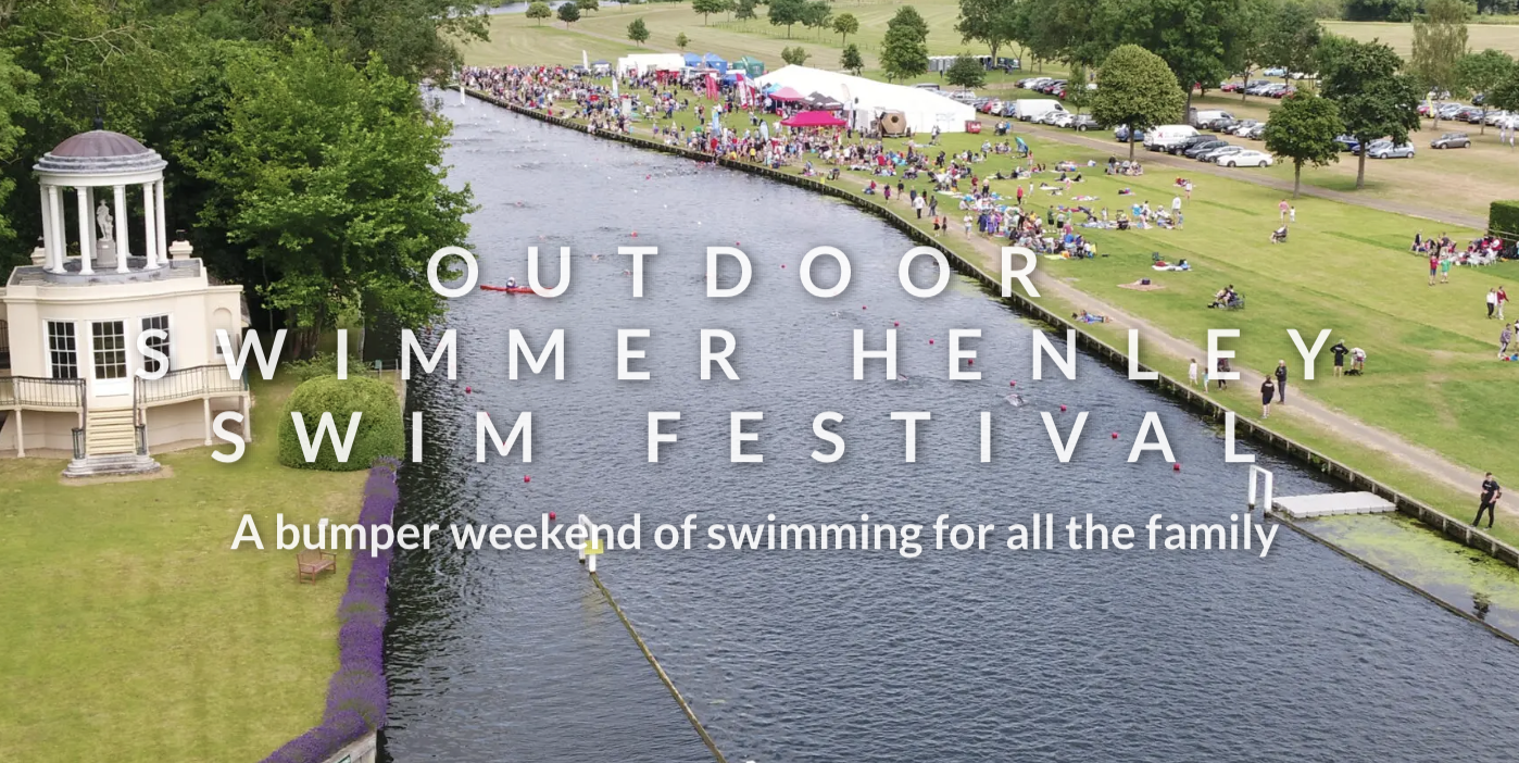 A scenic view of the Outdoor Swimmer Henley Swim Festival. Participants and spectators are gathered along the riverbank. The event area includes tents and open green spaces. Text reads: "Outdoor Swimmer Henley Swim Festival - A bumper weekend of swimming for all the family.