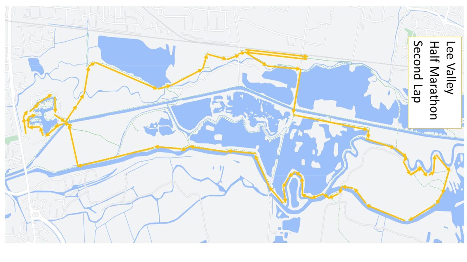 A map of the Lee Valley Half Marathon second lap. The route is highlighted in yellow and travels through various water bodies and green areas in the Lee Valley. It includes loops and several turns, with noticeable blue water bodies along the way.